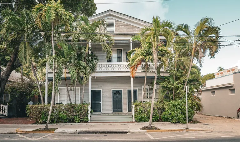 Florida-style home framed by palm trees
