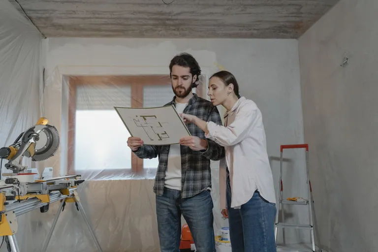 Home renovation plans being reviewed in a work area